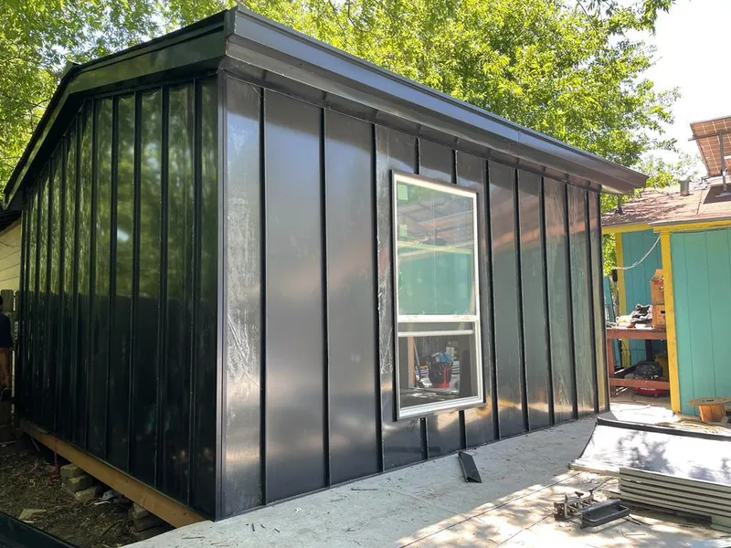 Black standing seam metal wall panels for Roof Inspection in Newman