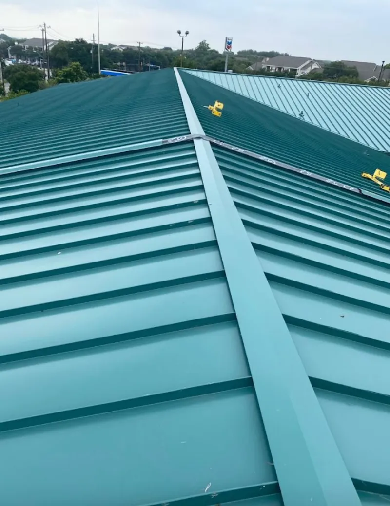 Green commercial metal roof ridge and valley for Metal Roof Repair in Newman