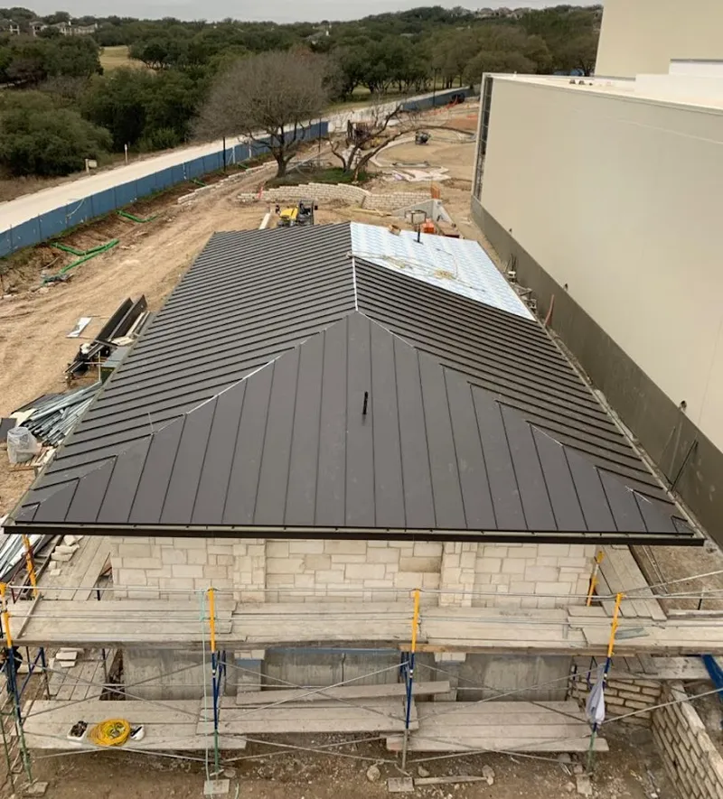 Metal roof new construction with scaffolding in Newman
